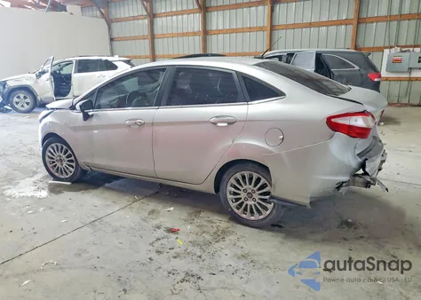 2014 Ford Fiesta Titanium z USA, uszkodzony, nr VIN 3FADP4CJXEM107270